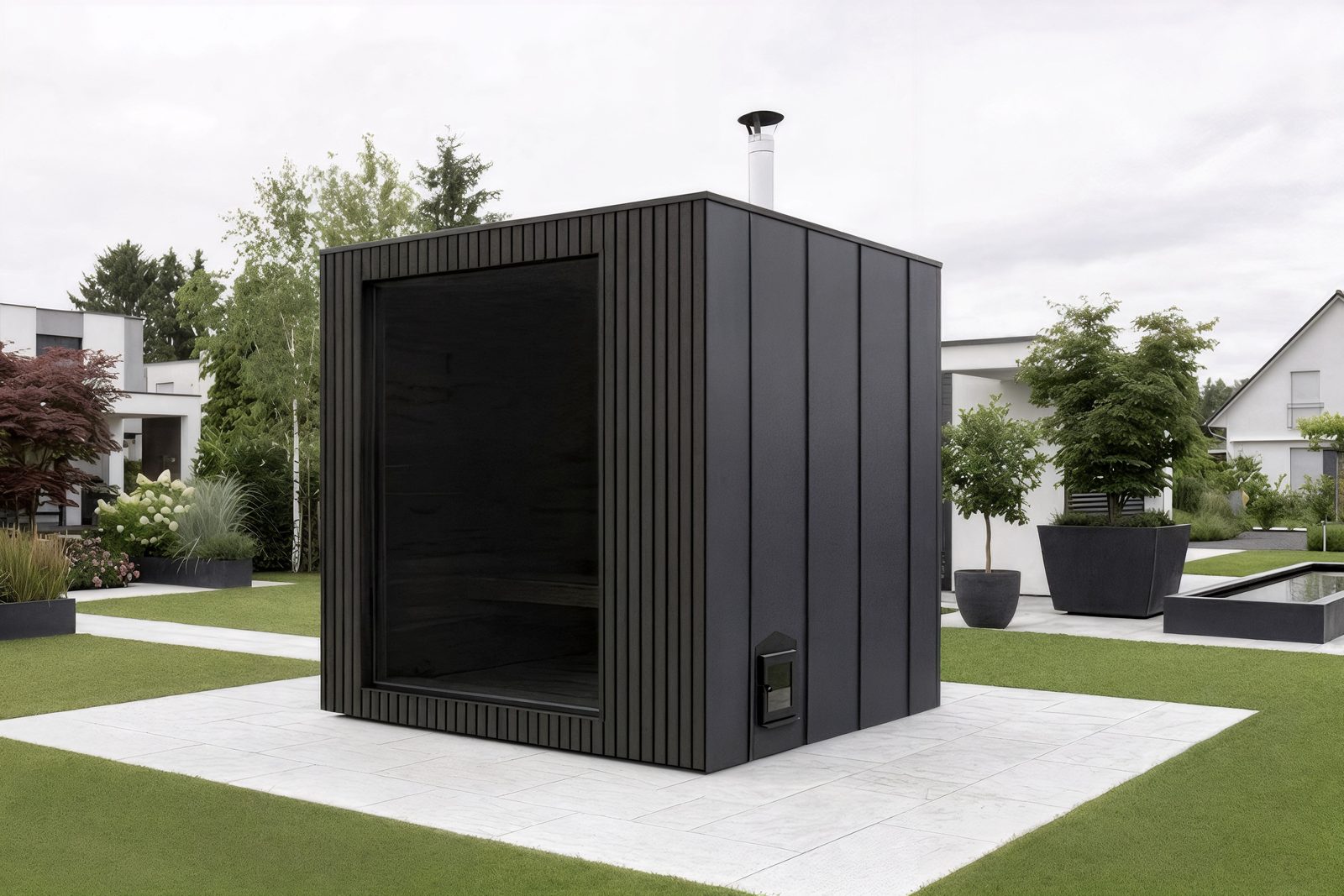 ARIES Cube Family 235 in Anthrazit – Seitenansicht mit Schornstein des Holzofens